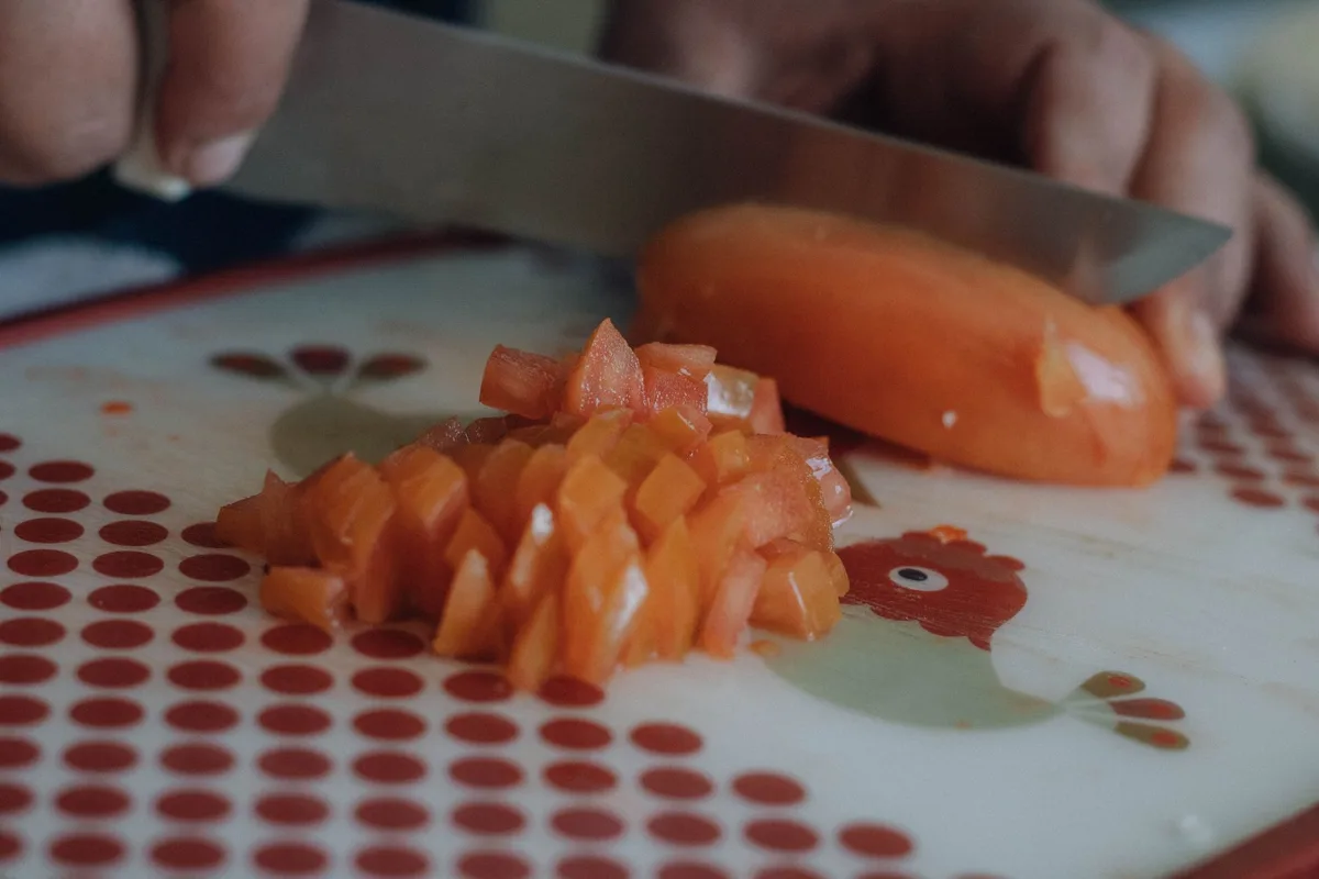 Chopping sun-dried tomatoes