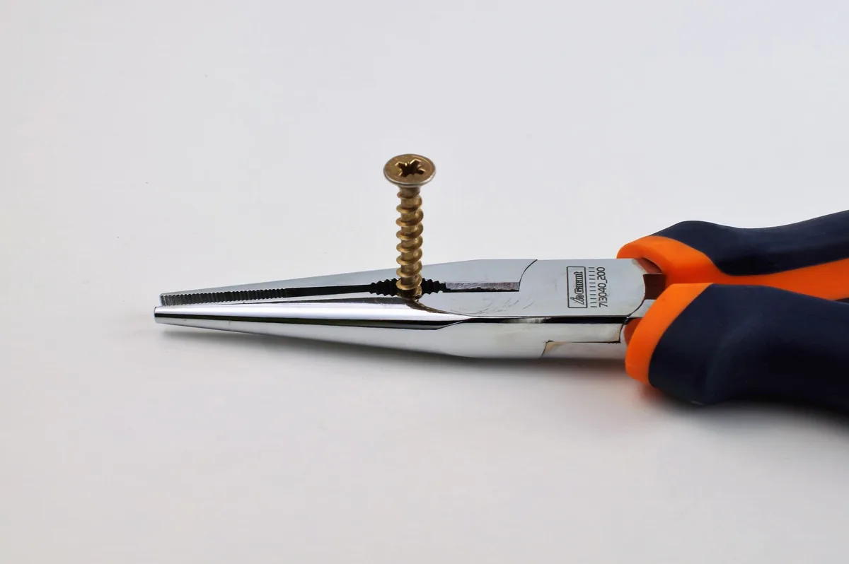 Screw in wine cork with pliers